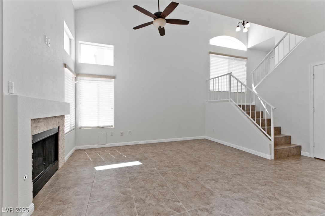 1663 Cloister Avenue Henderson, NV 89014 - Photo 5 of 35 Unfurnished living room with high vaulted ceiling,