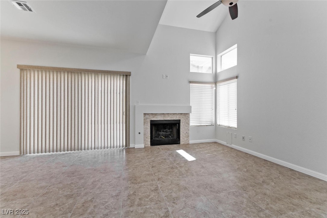 1663 Cloister Avenue Henderson, NV 89014 - Photo 8 of 35 Unfurnished living room featuring a ceiling fan, h