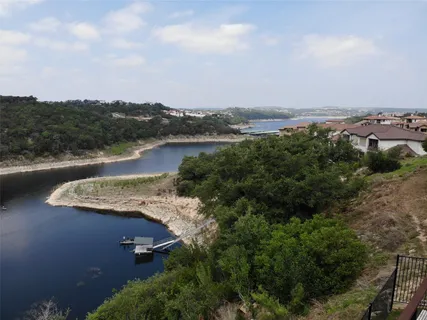 an aerial view of residential house with outdoor space and lake view