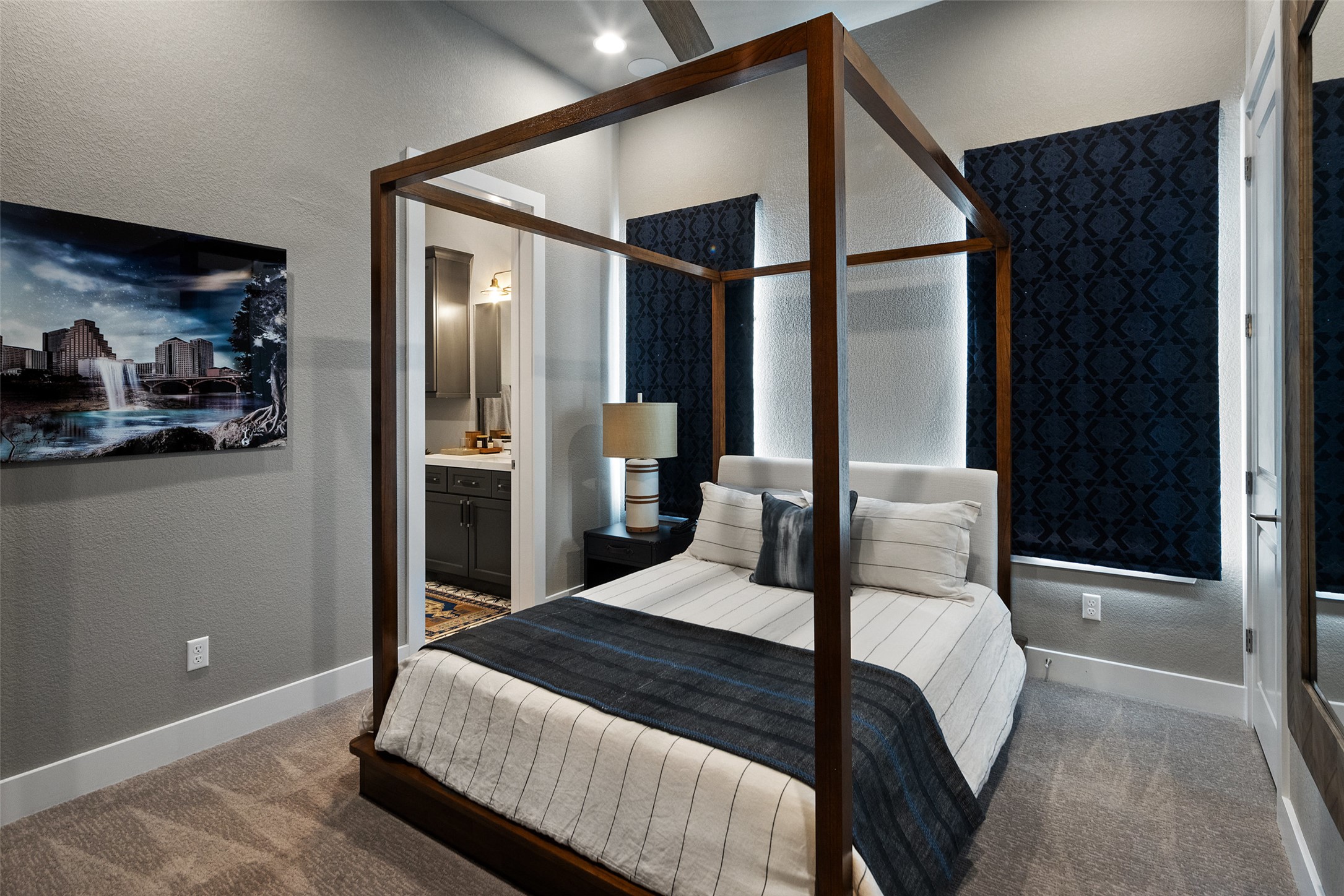 420 Marina View Way Austin, TX 78734 - Photo 26 of 32 a bedroom with a large bed and a painting on the wall