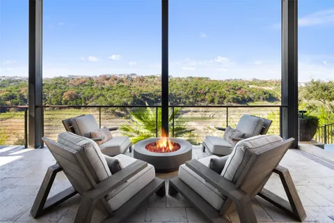 a view of house with outdoor space and sitting area