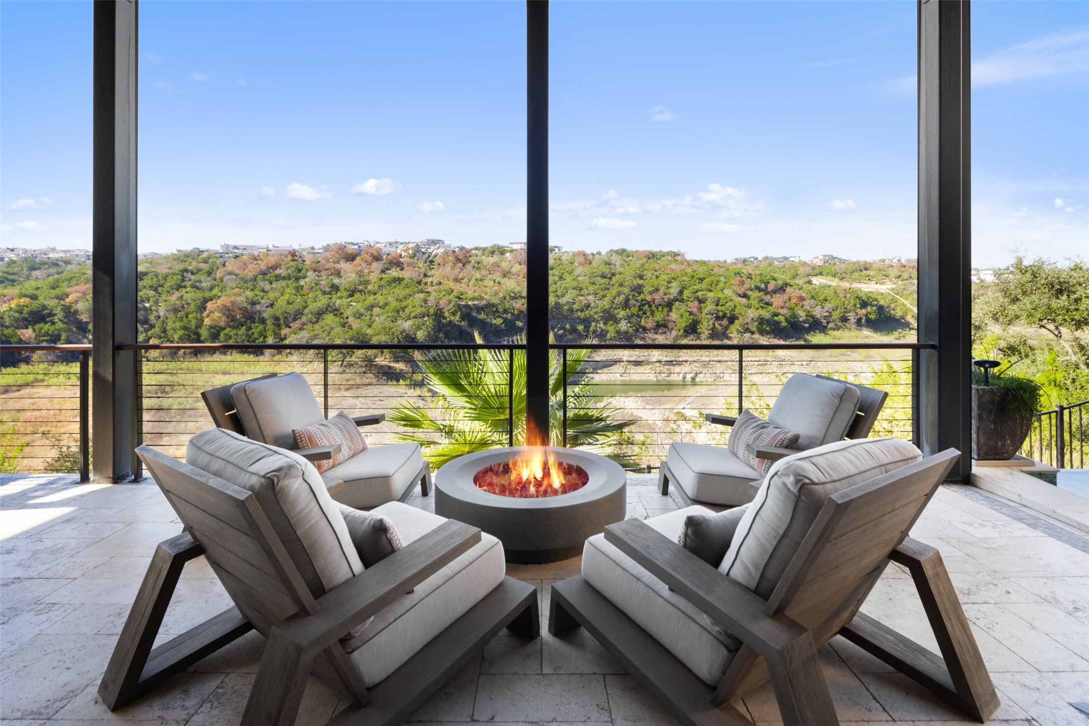 420 Marina View Way Austin, TX 78734 - Photo 29 of 32 a view of a patio with couches chairs and a potted plant