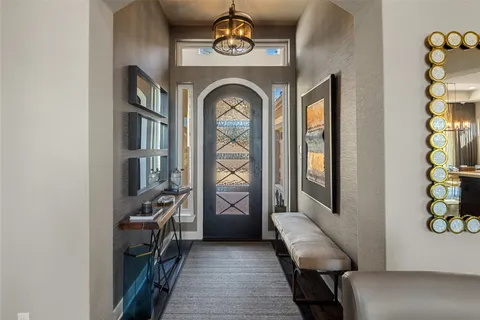 a view of entryway and hall with wooden floor