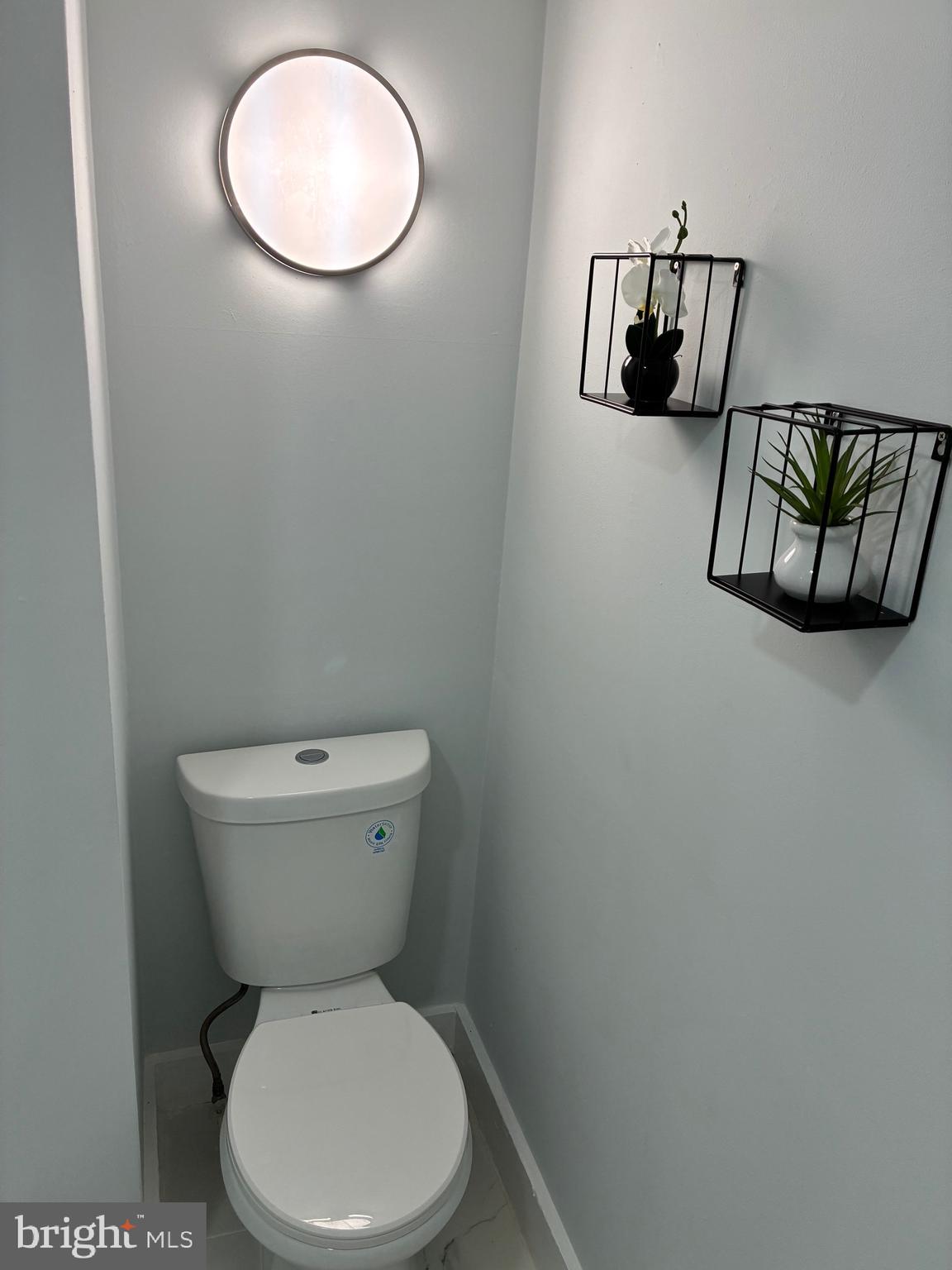 2704 Marbourne Avenue Baltimore, MD 21230 - Photo 11 of 46 a white toilet sitting next to a white cabinet