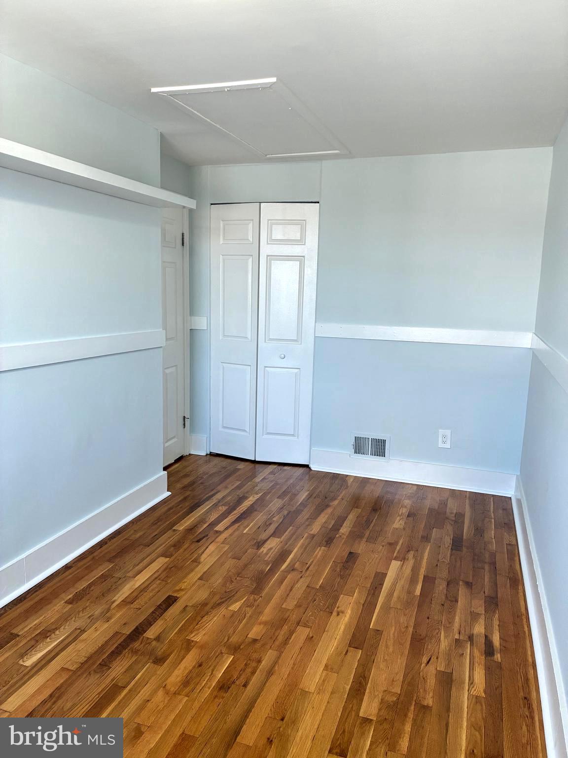 2704 Marbourne Avenue Baltimore, MD 21230 - Photo 25 of 46 a view of an empty room with wooden floor and closet