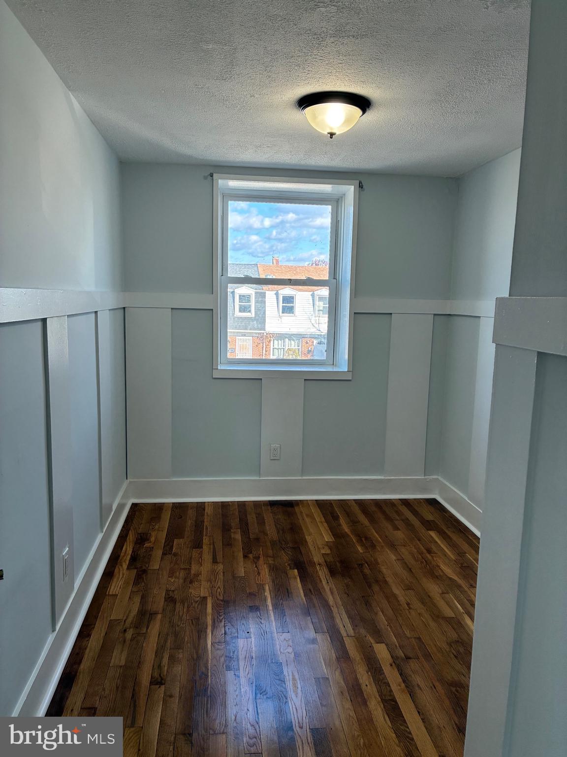 2704 Marbourne Avenue Baltimore, MD 21230 - Photo 27 of 46 wooden floor in an empty room with a window
