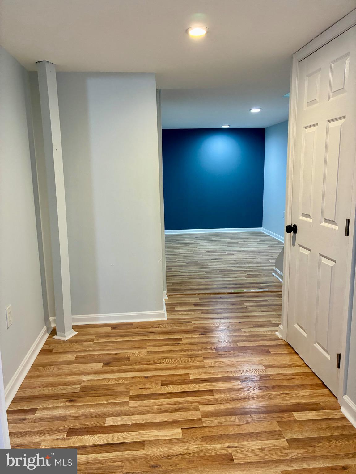 2704 Marbourne Avenue Baltimore, MD 21230 - Photo 32 of 46 a view of a livingroom with wooden floor and staircase