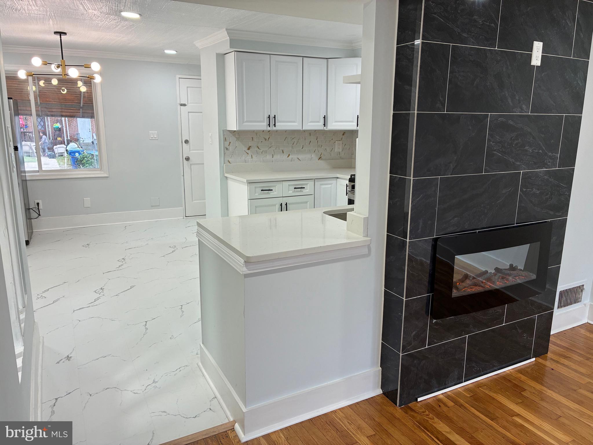 2704 Marbourne Avenue Baltimore, MD 21230 - Photo 7 of 46 a kitchen with a refrigerator and a sink