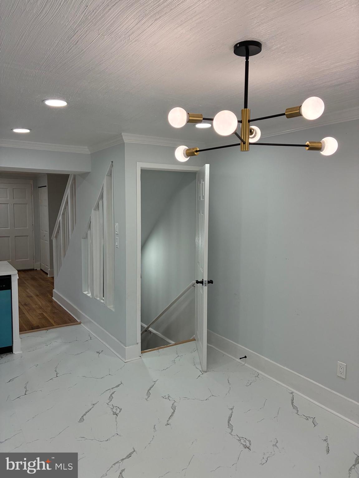 2704 Marbourne Avenue Baltimore, MD 21230 - Photo 9 of 46 a view of a room with a sink and chandelier