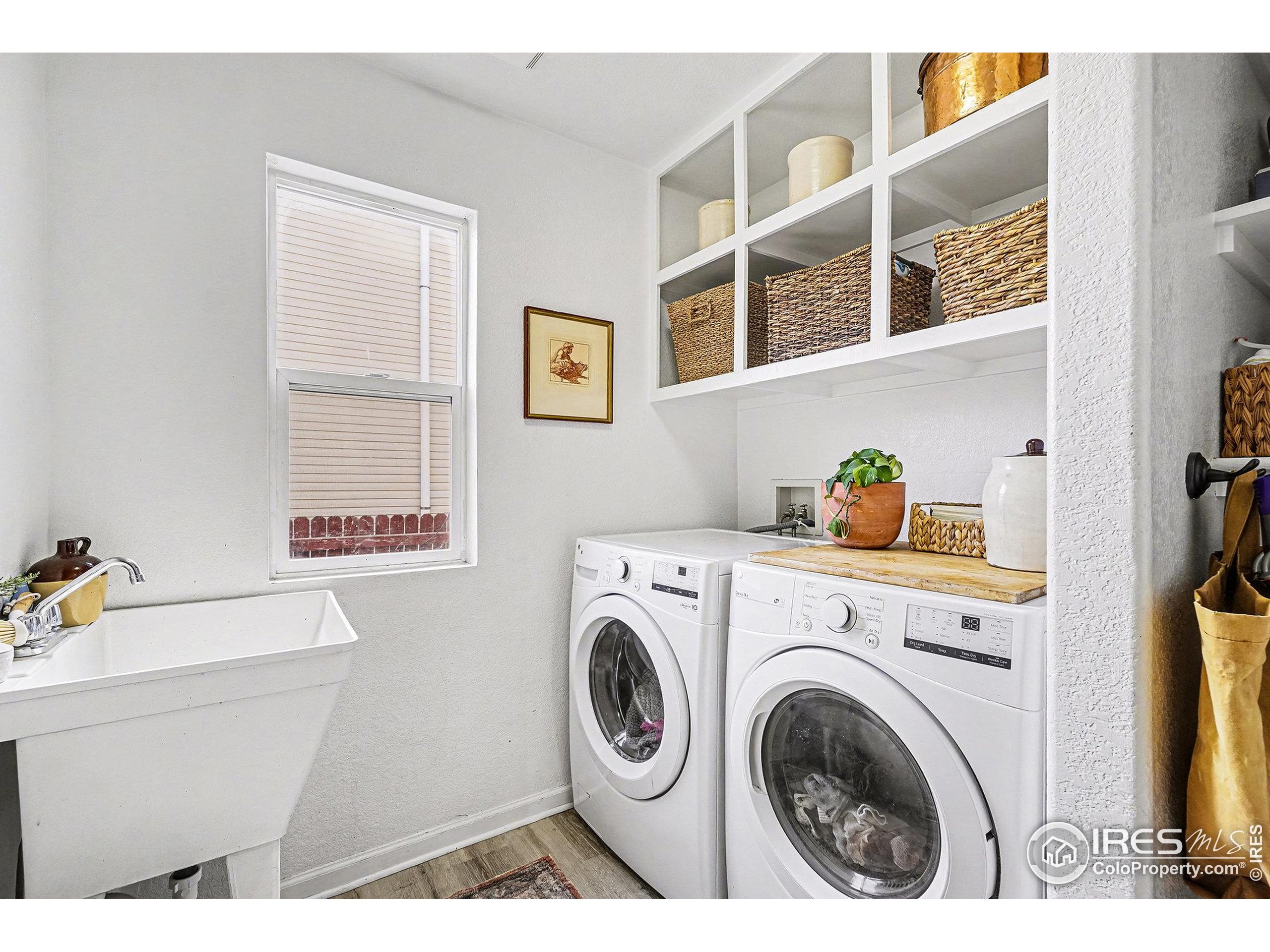 1244 Spring Creek Court Longmont, CO 80504 - Photo 16 of 32 a utility room with dryer and washer