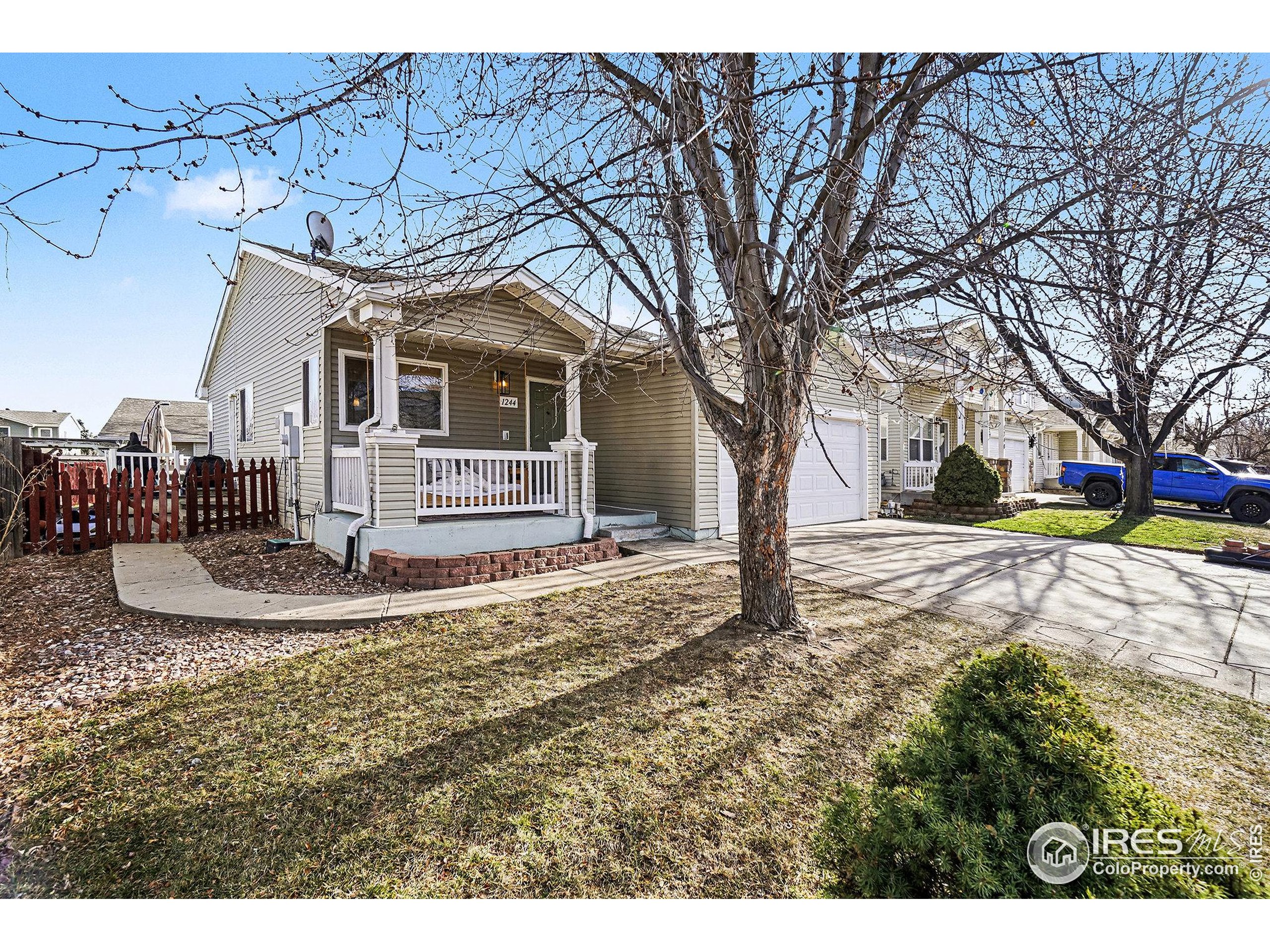 1244 Spring Creek Court Longmont, CO 80504 - Photo 2 of 32 a view of a house with a yard