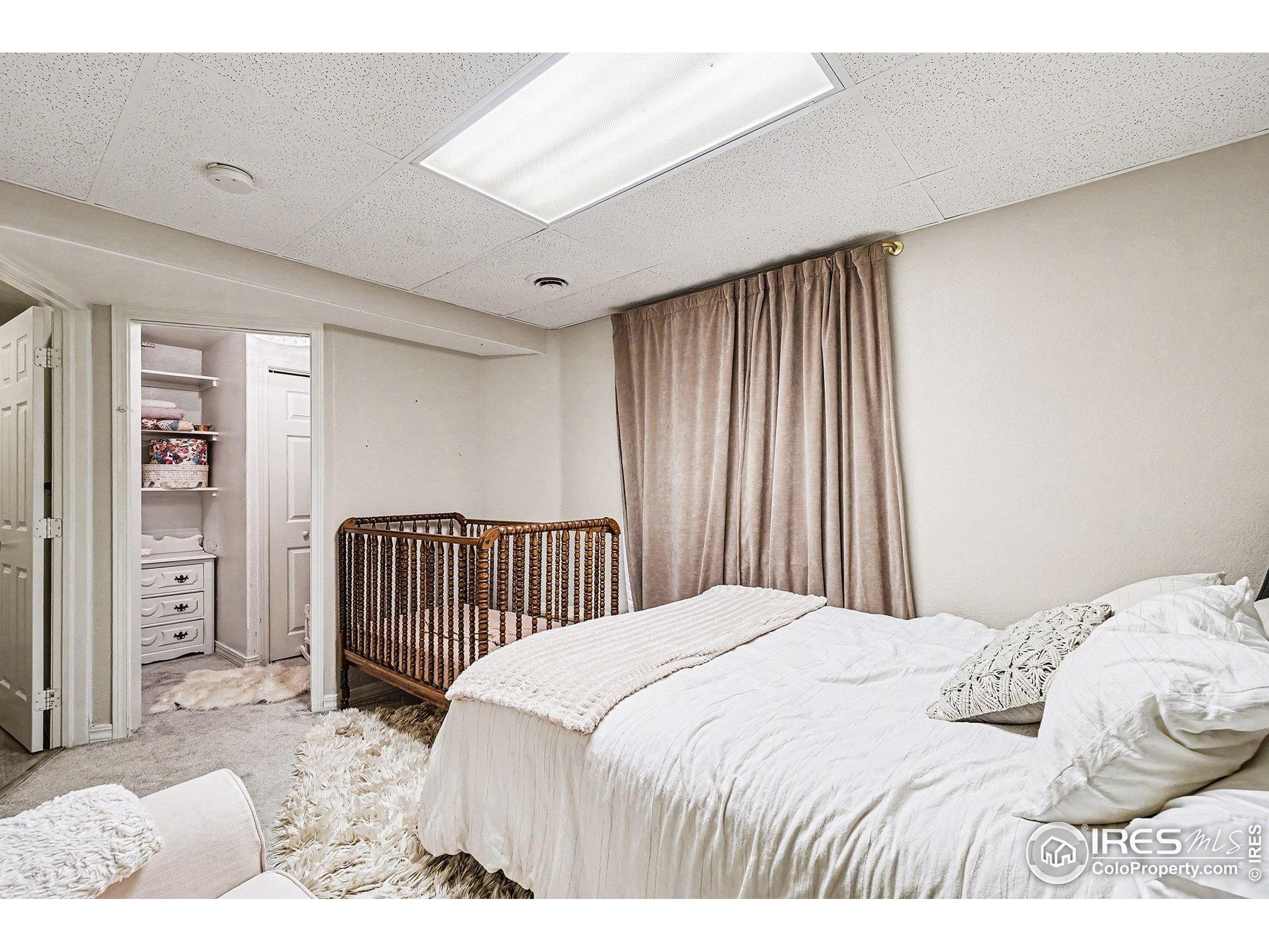 1244 Spring Creek Court Longmont, CO 80504 - Photo 23 of 32 a bedroom with a bed and a window