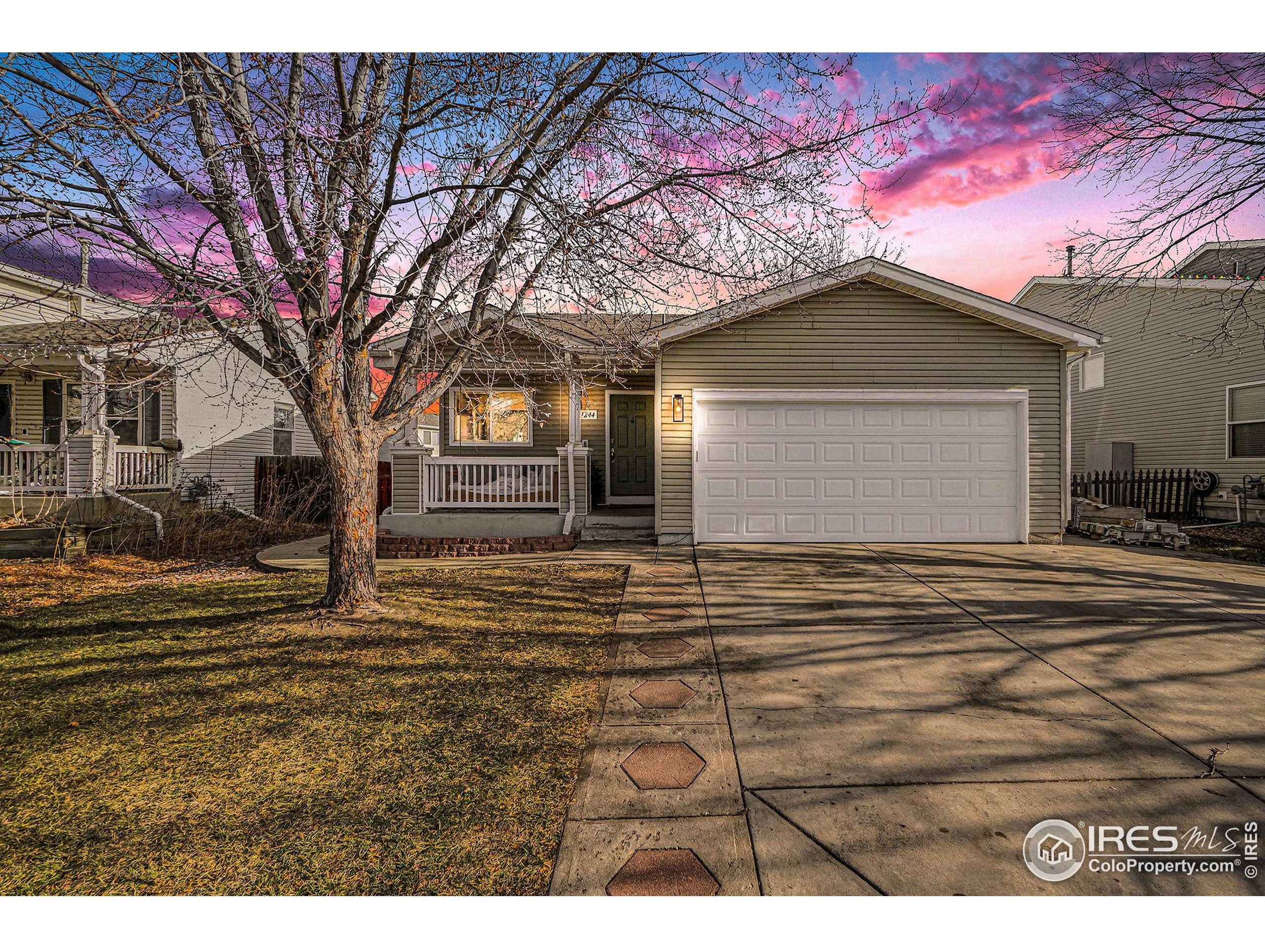 1244 Spring Creek Court Longmont, CO 80504 - Photo 32 of 32 a view of a house with a yard