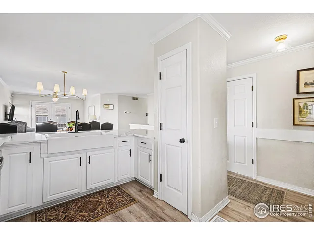 a open white kitchen with cabinets