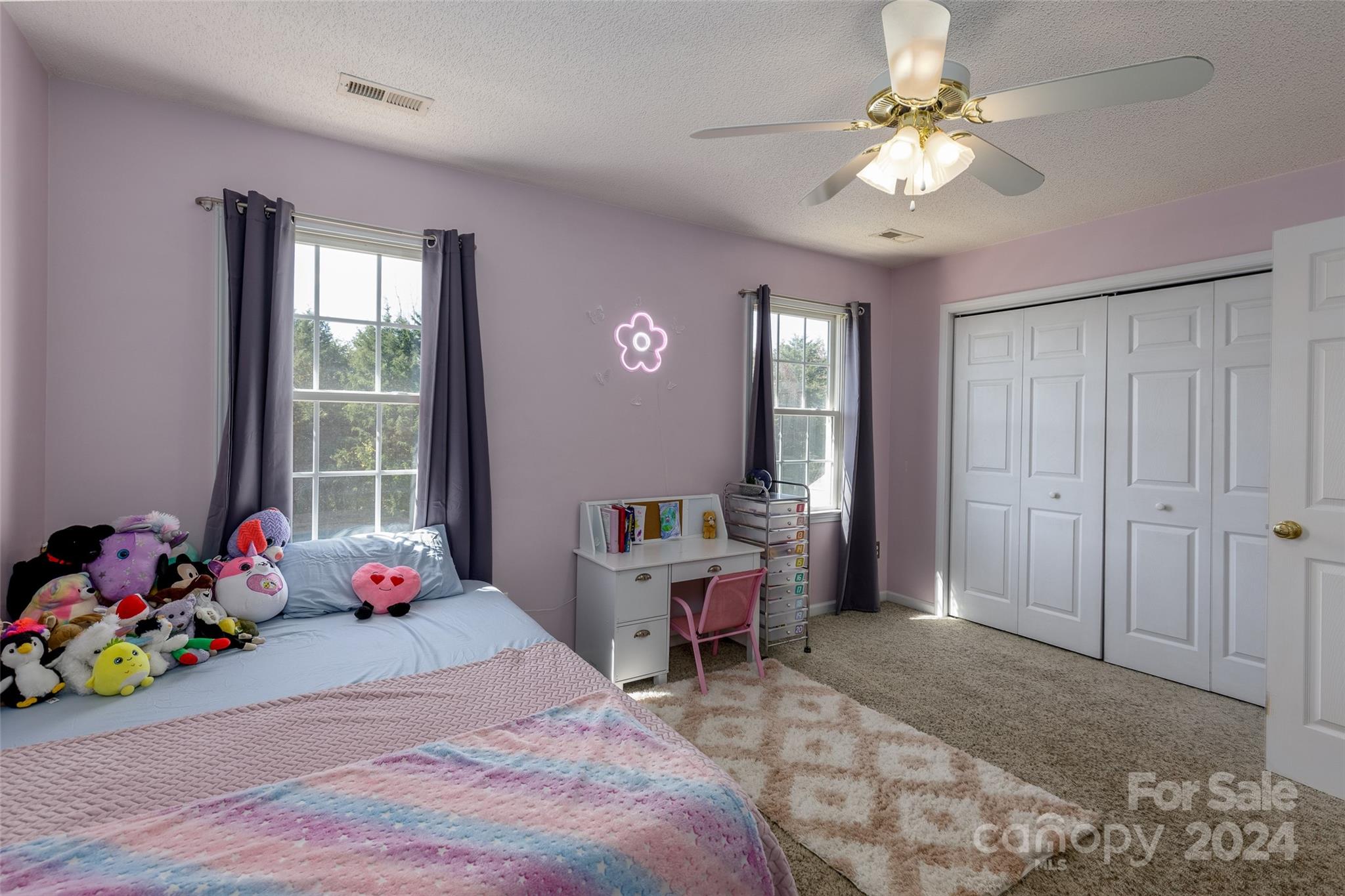 223 Adrian Road Salisbury, NC 28146 - Photo 23 of 34 a bedroom with a bed and furniture
