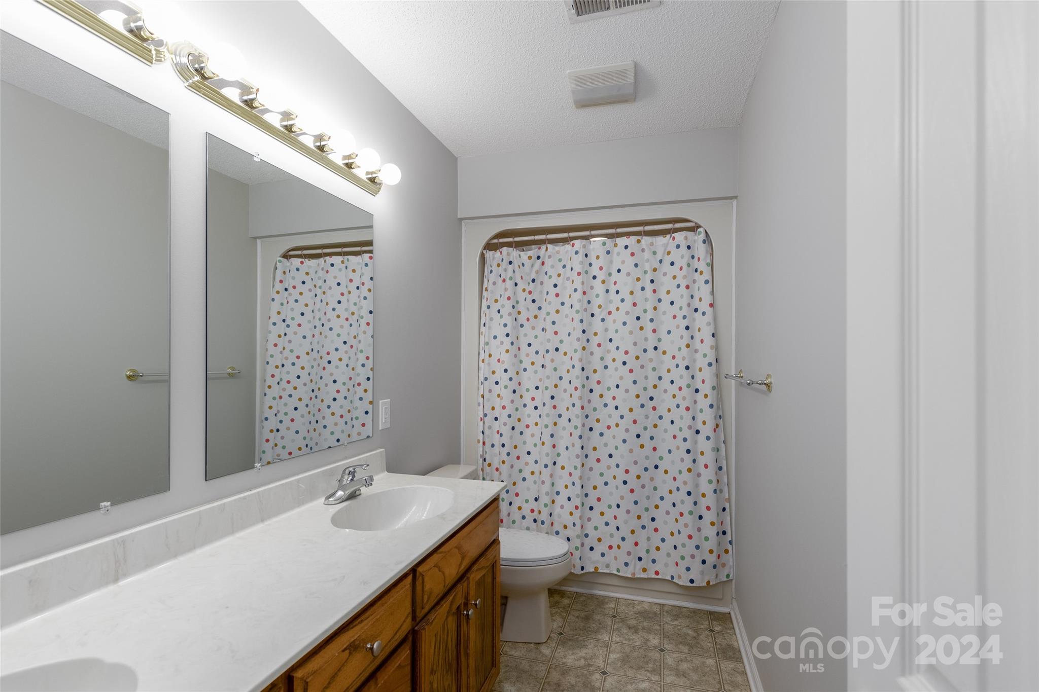 223 Adrian Road Salisbury, NC 28146 - Photo 27 of 34 a bathroom with a sink a toilet and shower
