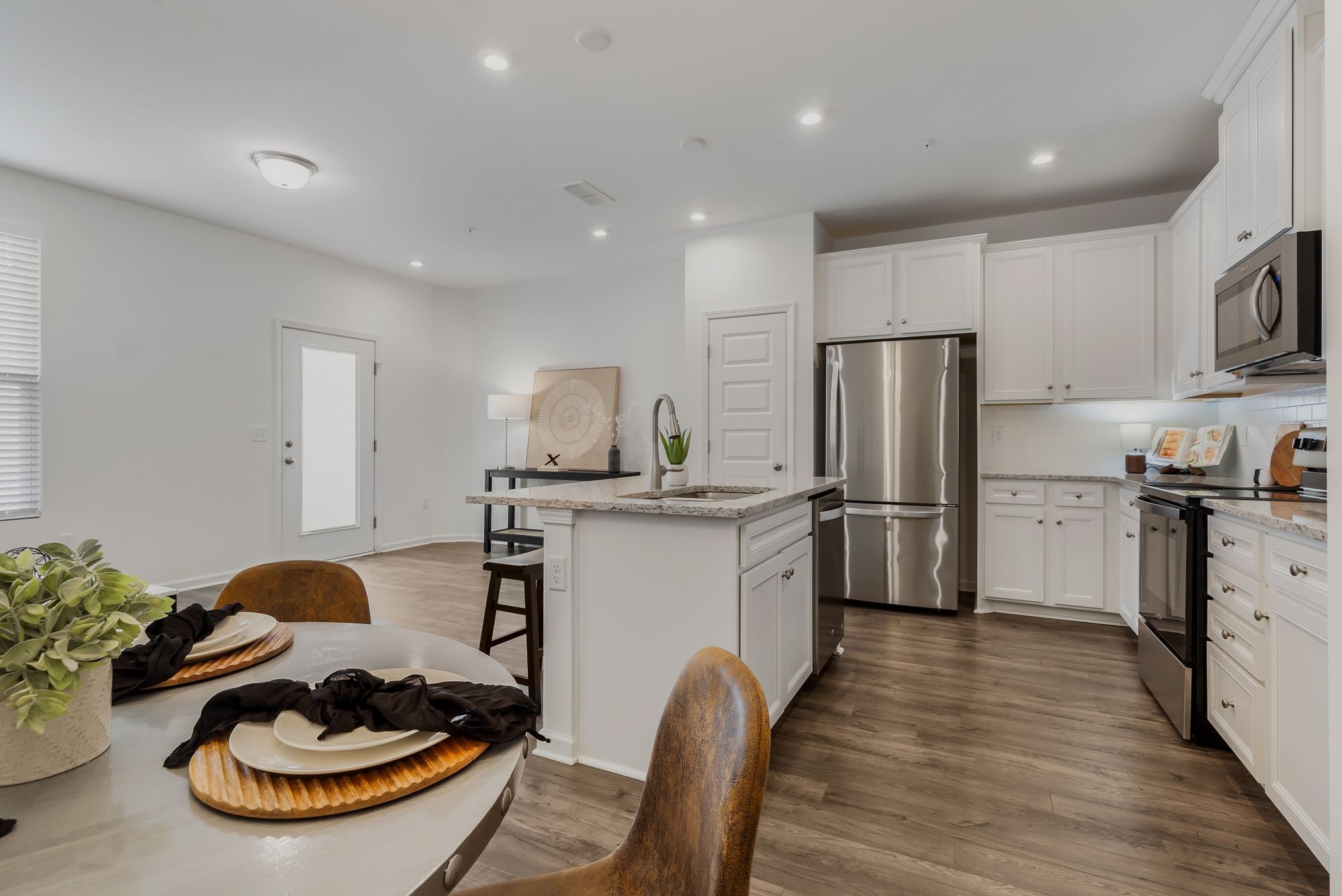 3419 Deerchase Circle Murfreesboro, TN 37129 - Photo 10 of 37 a kitchen with stainless steel appliances granite countertop a sink dishwasher a refrigerator and a stove with wooden floor