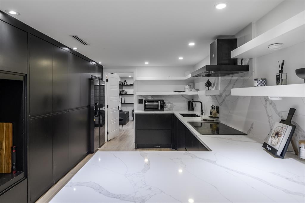 602 Ferris Road Ferris, TX 75125 - Photo 7 of 32 CABINETS ARE BLACK AND TO THE LEFT ALONG THE WALL