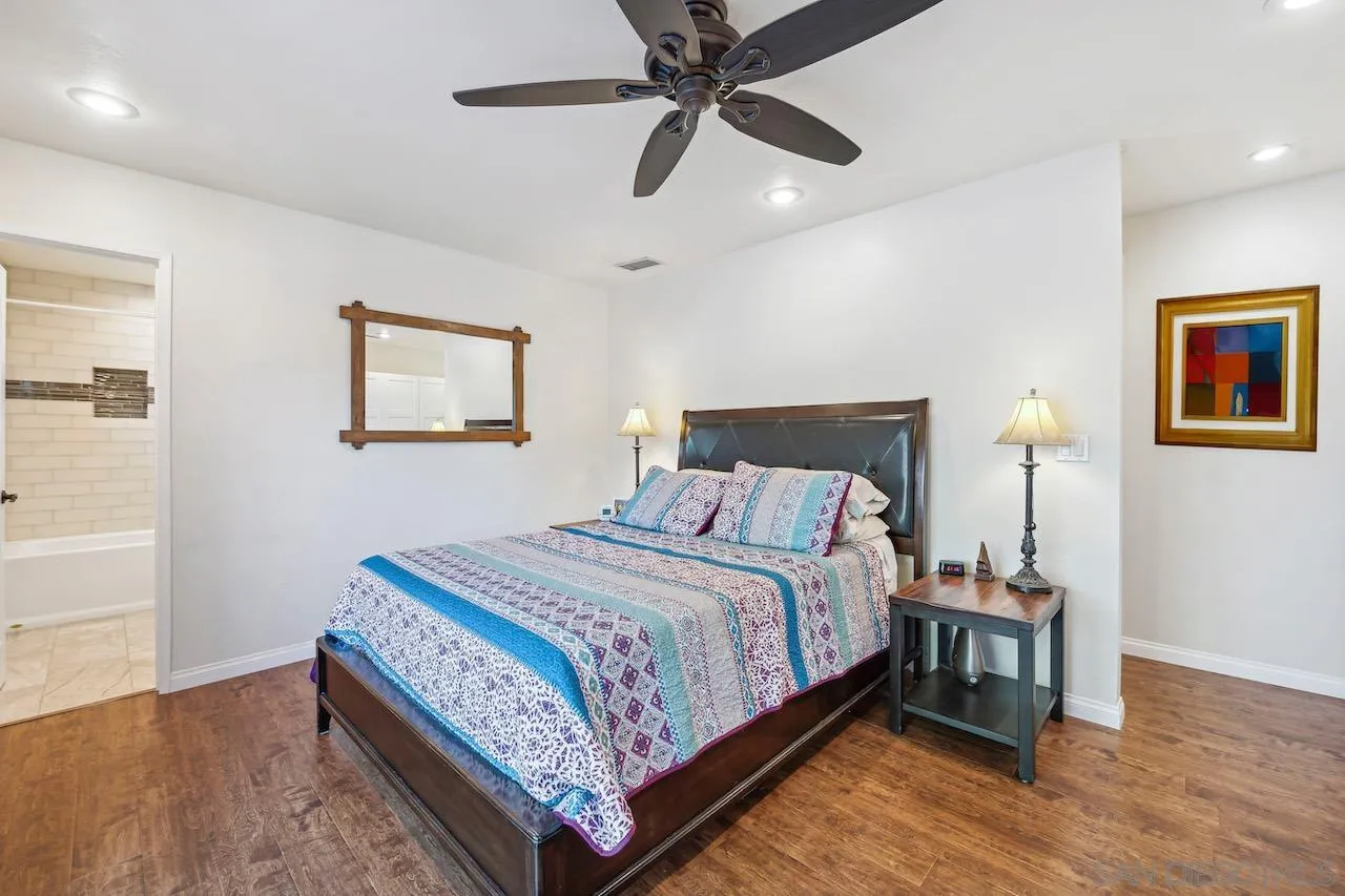 2952 Milpas Drive Escondido, CA 92029 - Photo 11 of 33 a bedroom with a bed and wooden floor