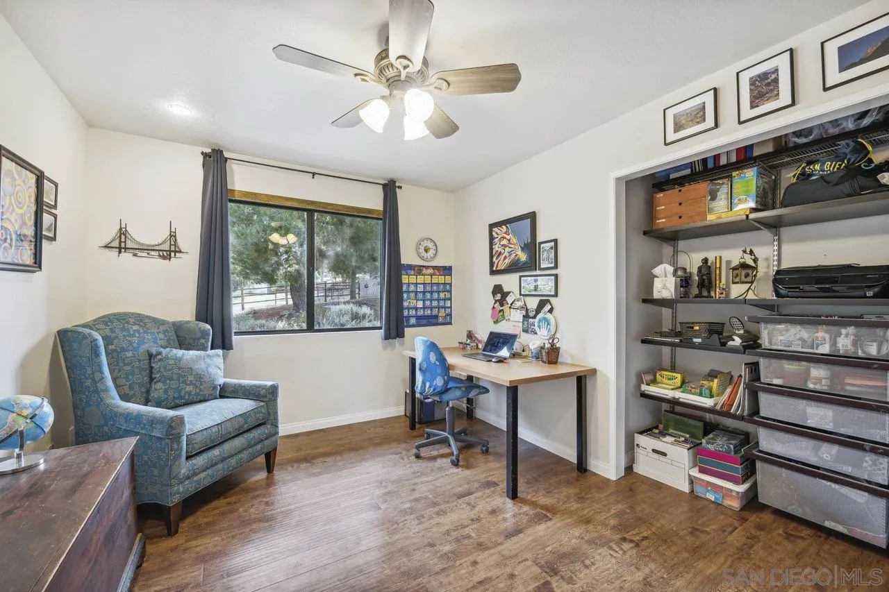 2952 Milpas Drive Escondido, CA 92029 - Photo 16 of 33 a living room with furniture cabinets and window