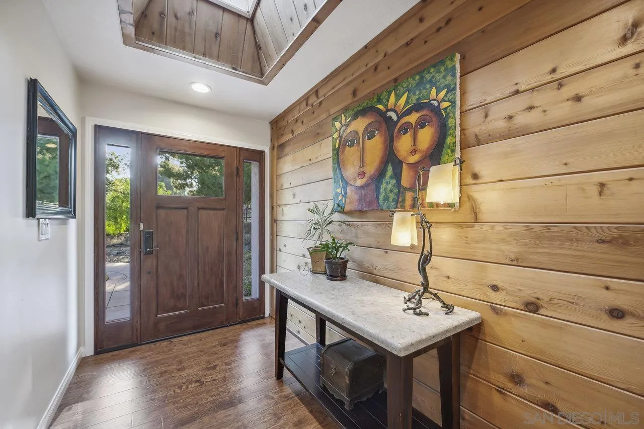2952 Milpas Drive Escondido, CA 92029 - Photo 2 of 33 a view of a hallway with wooden floor and cabinet