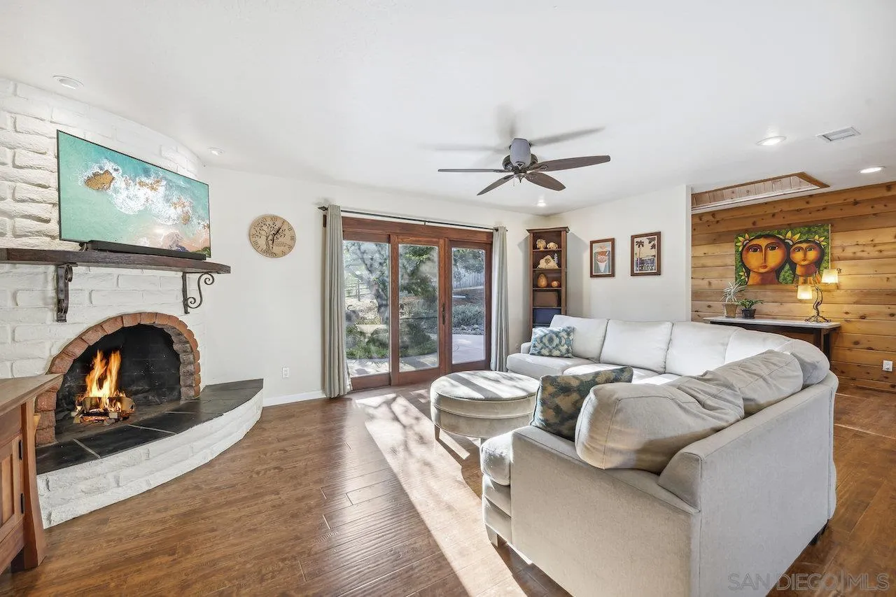 2952 Milpas Drive Escondido, CA 92029 - Photo 3 of 33 a living room with furniture and a fireplace