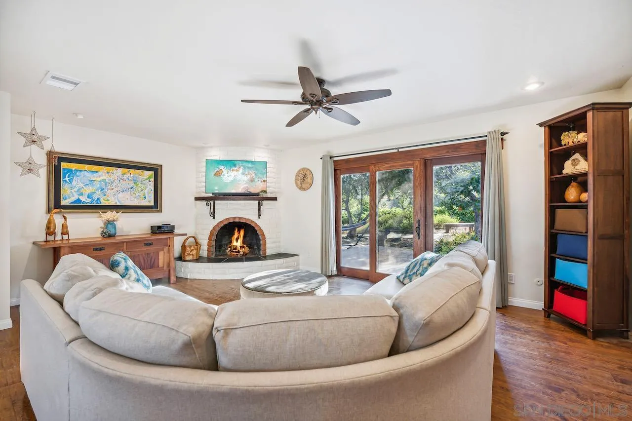 2952 Milpas Drive Escondido, CA 92029 - Photo 4 of 33 a living room with fireplace furniture and a flat screen tv