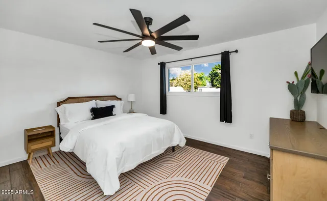 a bedroom with a bed and a window