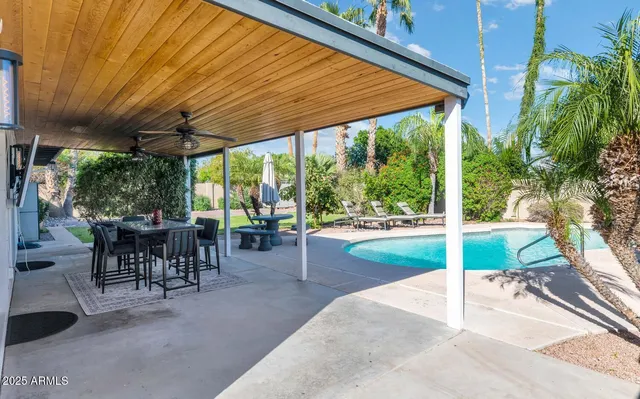 a view of a patio with a backyard