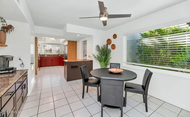 a dining room with furniture and window