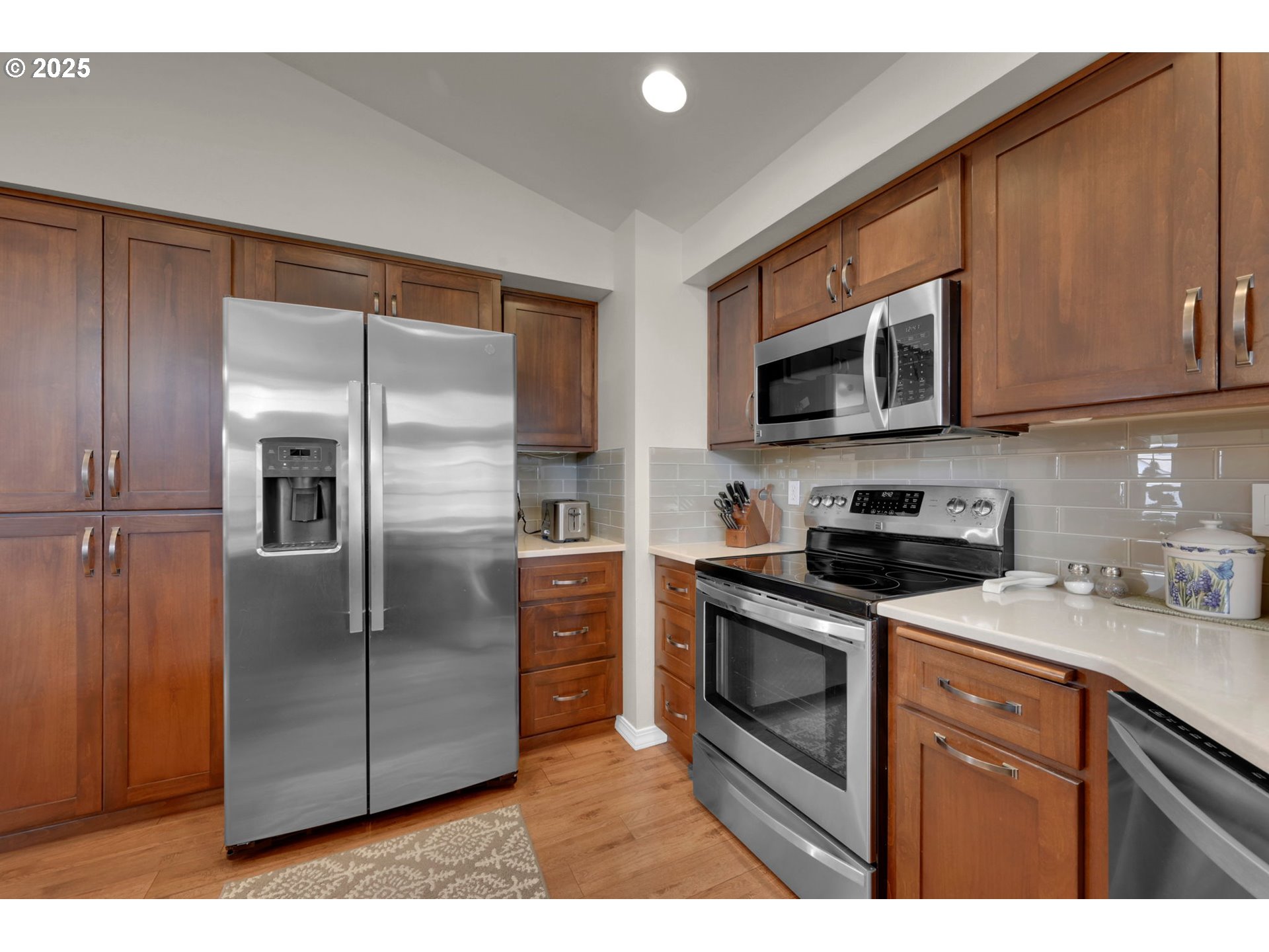 2458 Otto Street Springfield, OR 97477 - Photo 12 of 37 a kitchen with stainless steel appliances granite countertop a refrigerator a stove a sink and dishwasher