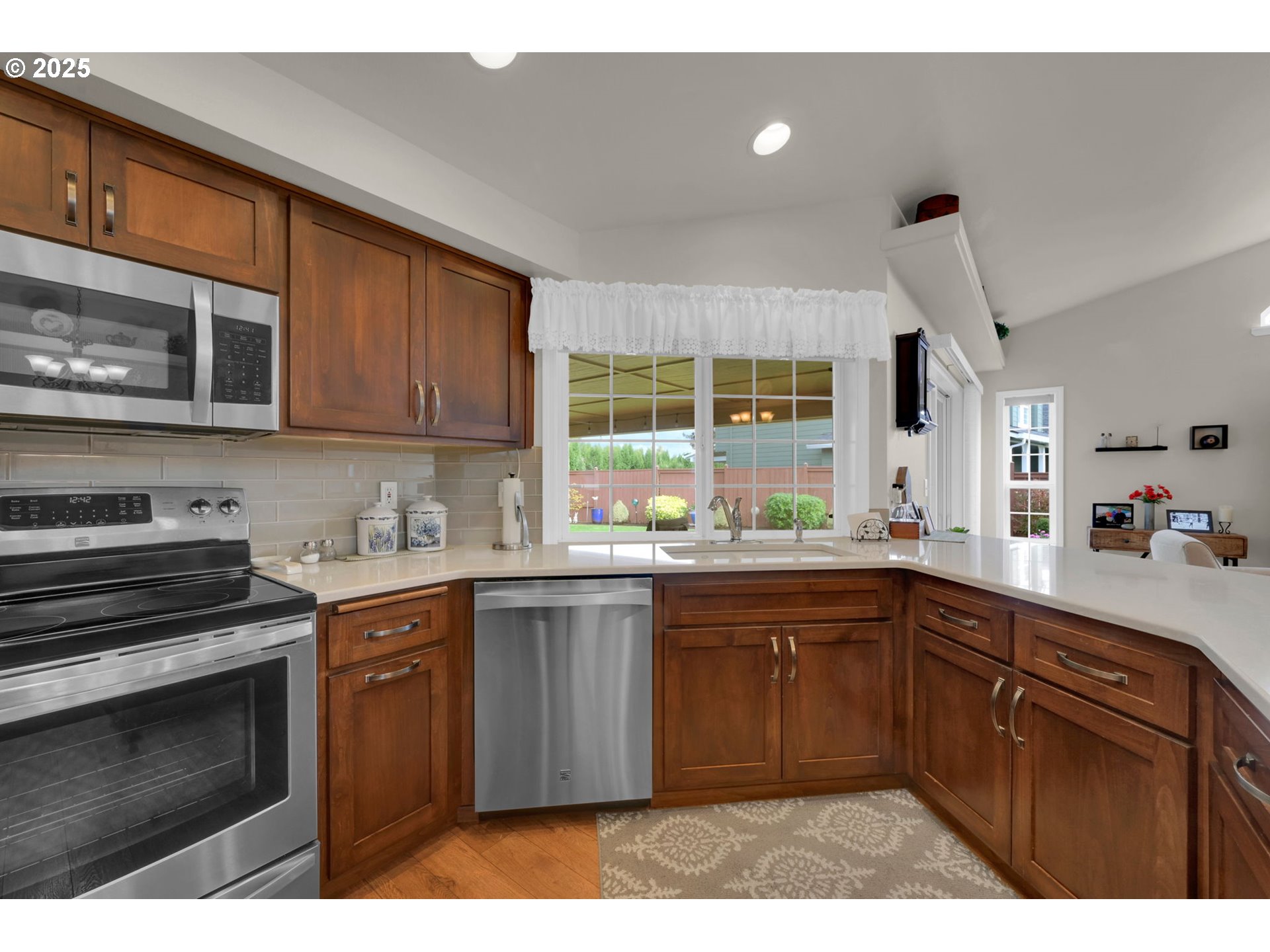 2458 Otto Street Springfield, OR 97477 - Photo 13 of 37 a kitchen with a sink stove and microwave