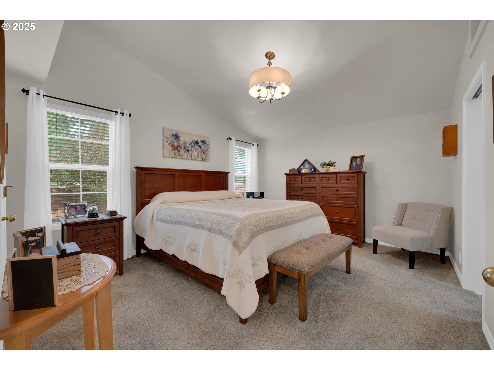 2458 Otto Street Springfield, OR 97477 - Photo 14 of 37 a bedroom with a bed and a chandelier