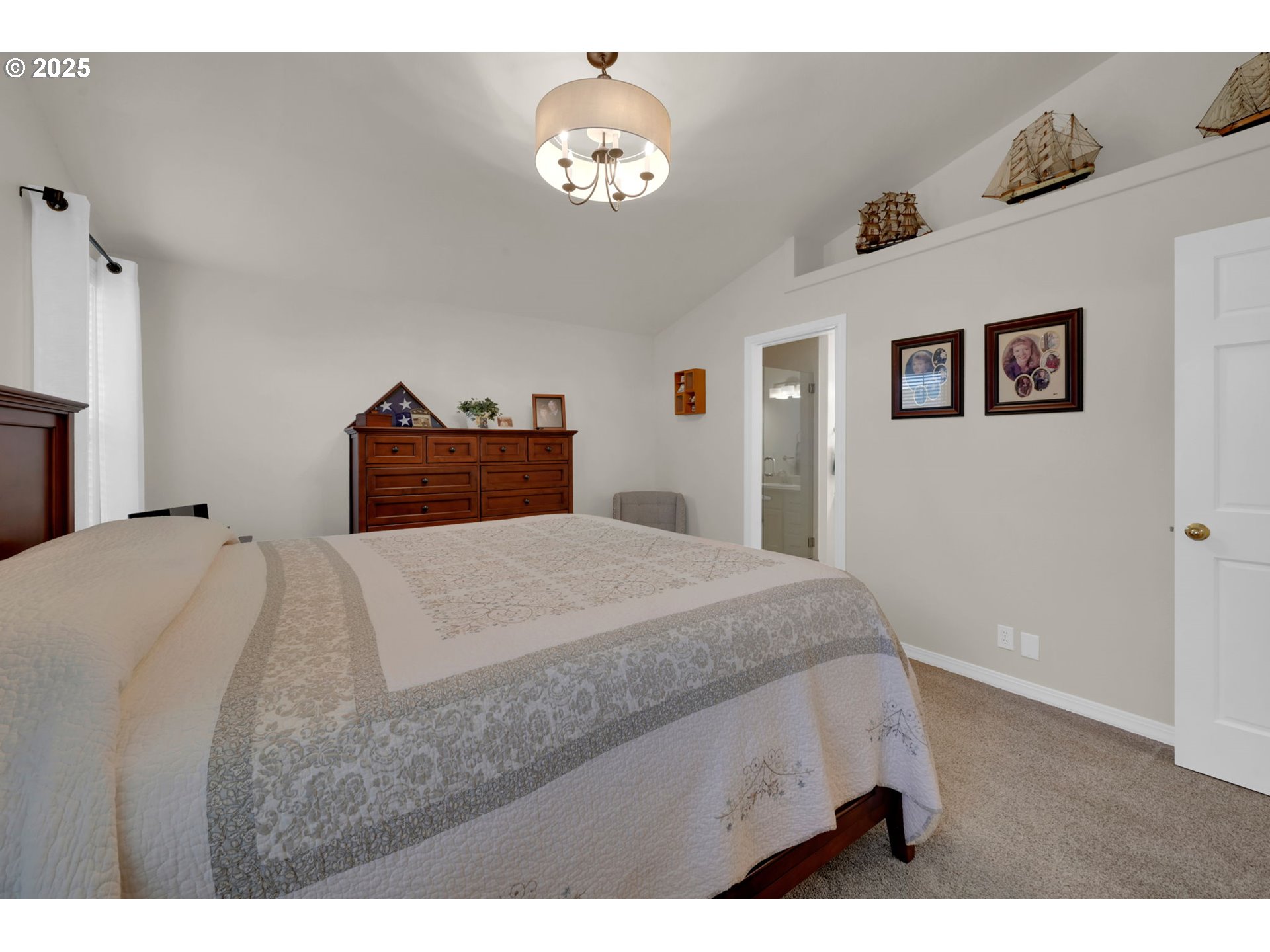 2458 Otto Street Springfield, OR 97477 - Photo 15 of 37 a bedroom with a bed and a chandelier