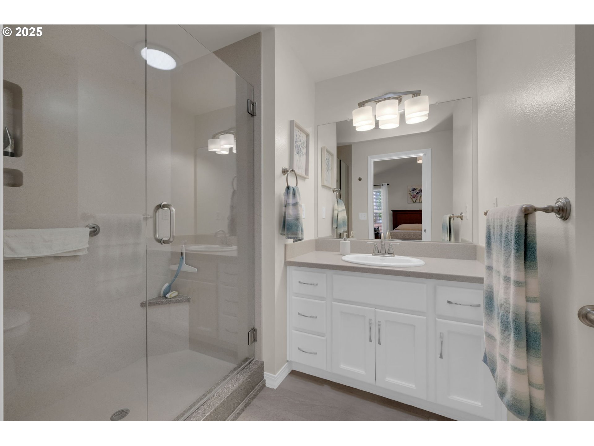 2458 Otto Street Springfield, OR 97477 - Photo 16 of 37 a bathroom with a granite countertop sink mirror and shower