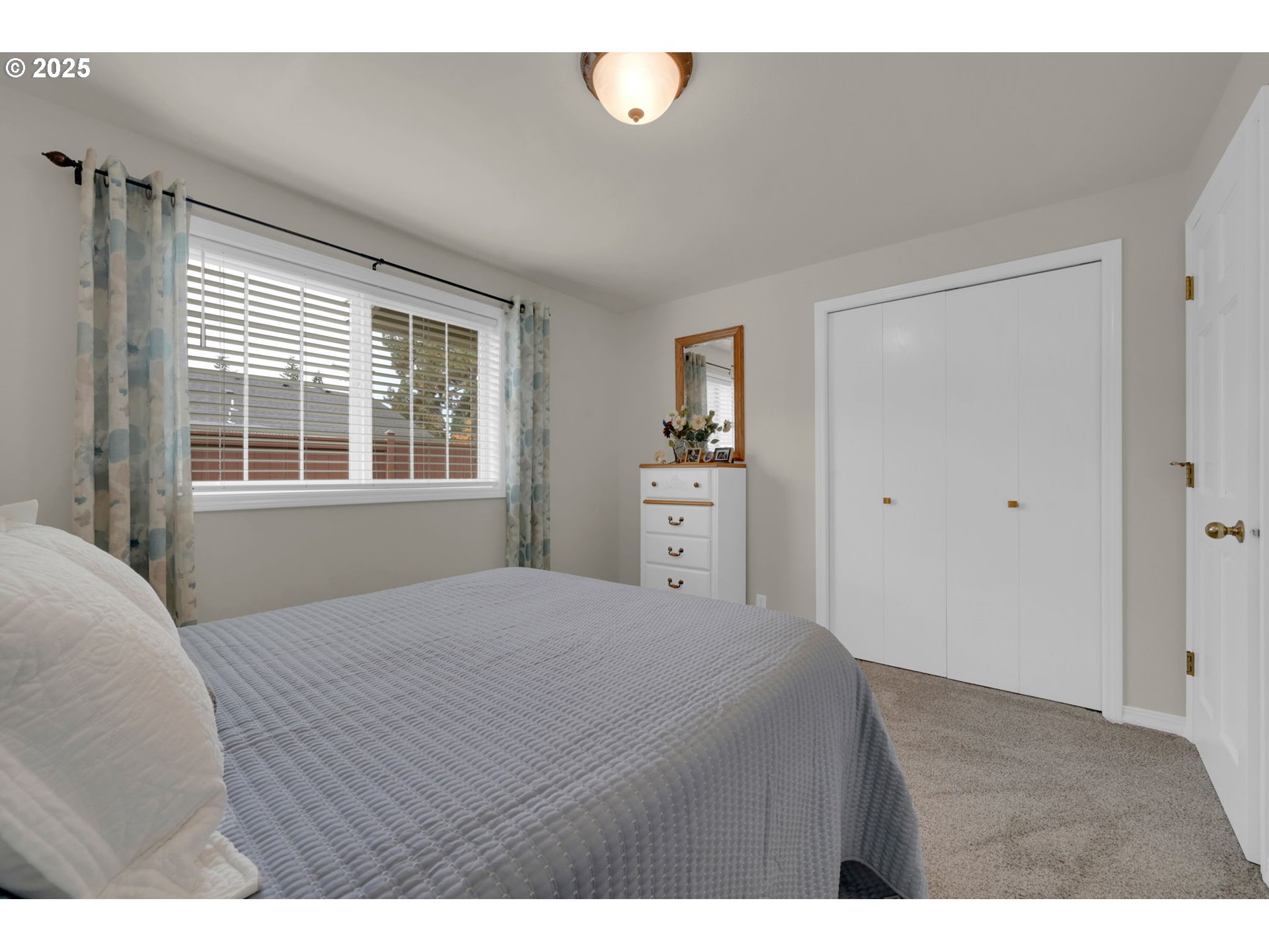 2458 Otto Street Springfield, OR 97477 - Photo 19 of 37 a bedroom with a bed and a window