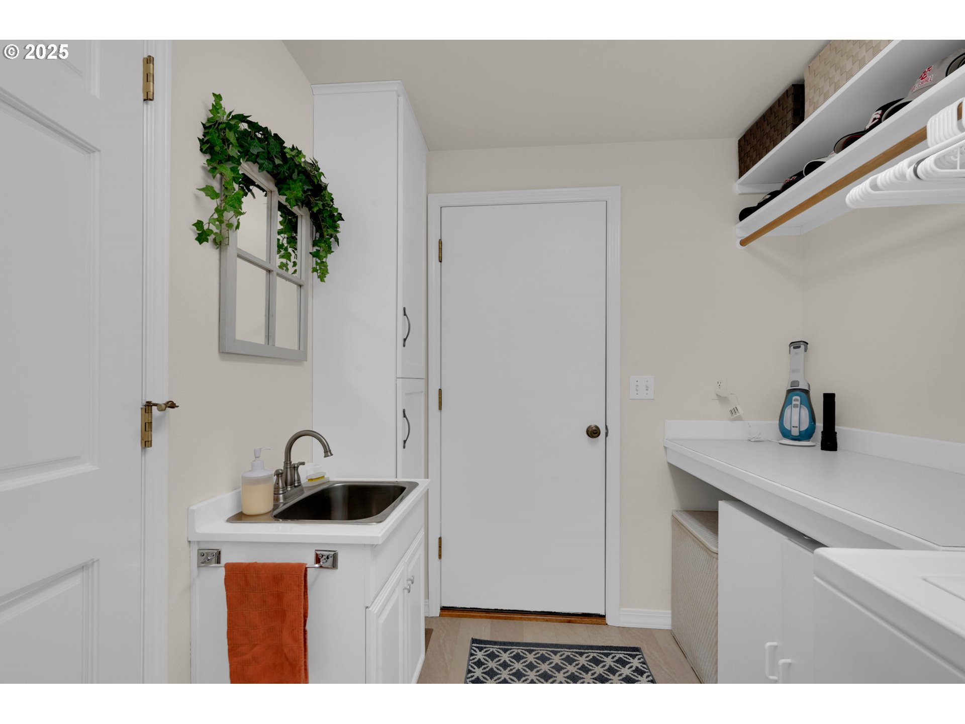 2458 Otto Street Springfield, OR 97477 - Photo 24 of 37 a kitchen with a sink a potted plant and cabinets