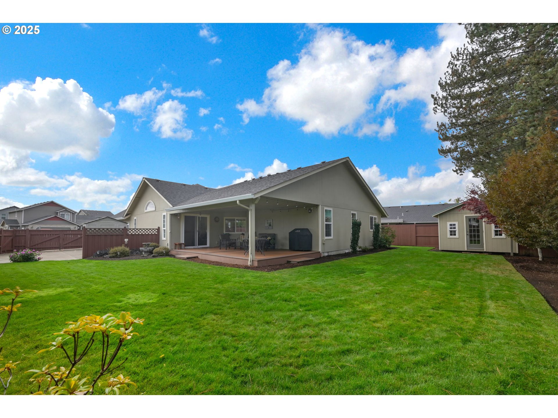 2458 Otto Street Springfield, OR 97477 - Photo 29 of 37 a view of a house with a big yard and large trees