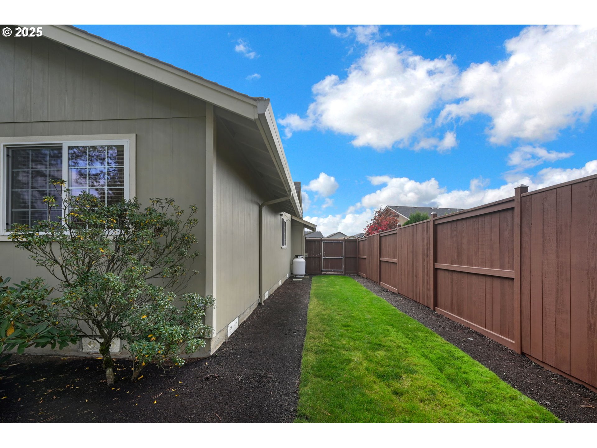 2458 Otto Street Springfield, OR 97477 - Photo 32 of 37 a view of a backyard with potted plants