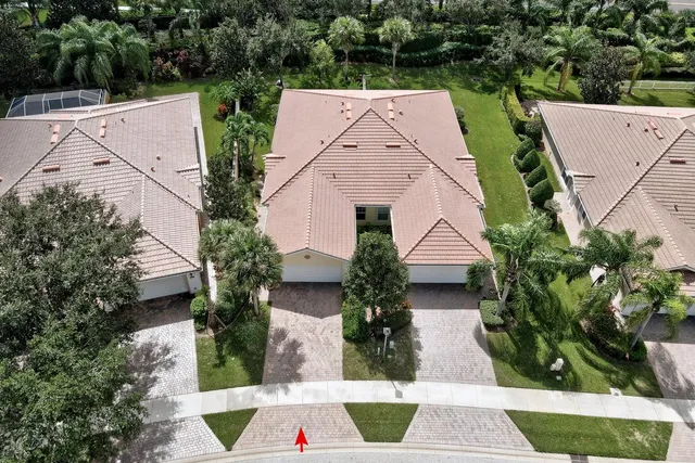 an aerial view of house with yard