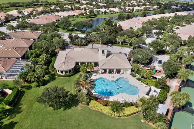 an aerial view of residential house with outdoor space and swimming pool