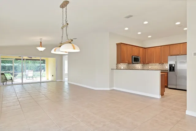 a view of a kitchen with a sink and a window