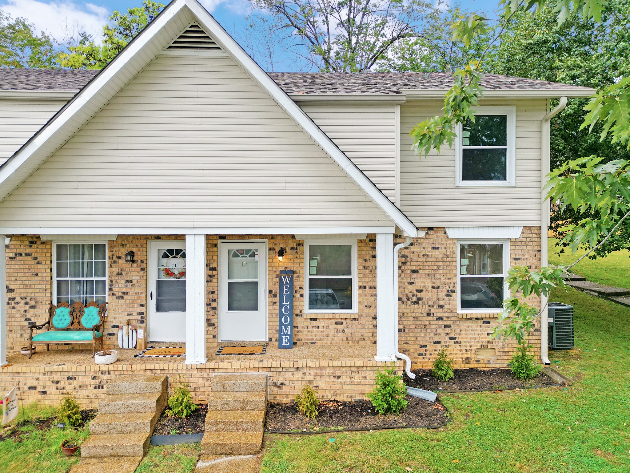 4000 Anderson Road, Unit 12 Nashville, TN 37217 - Photo 1 of 28 a front view of a house with a yard