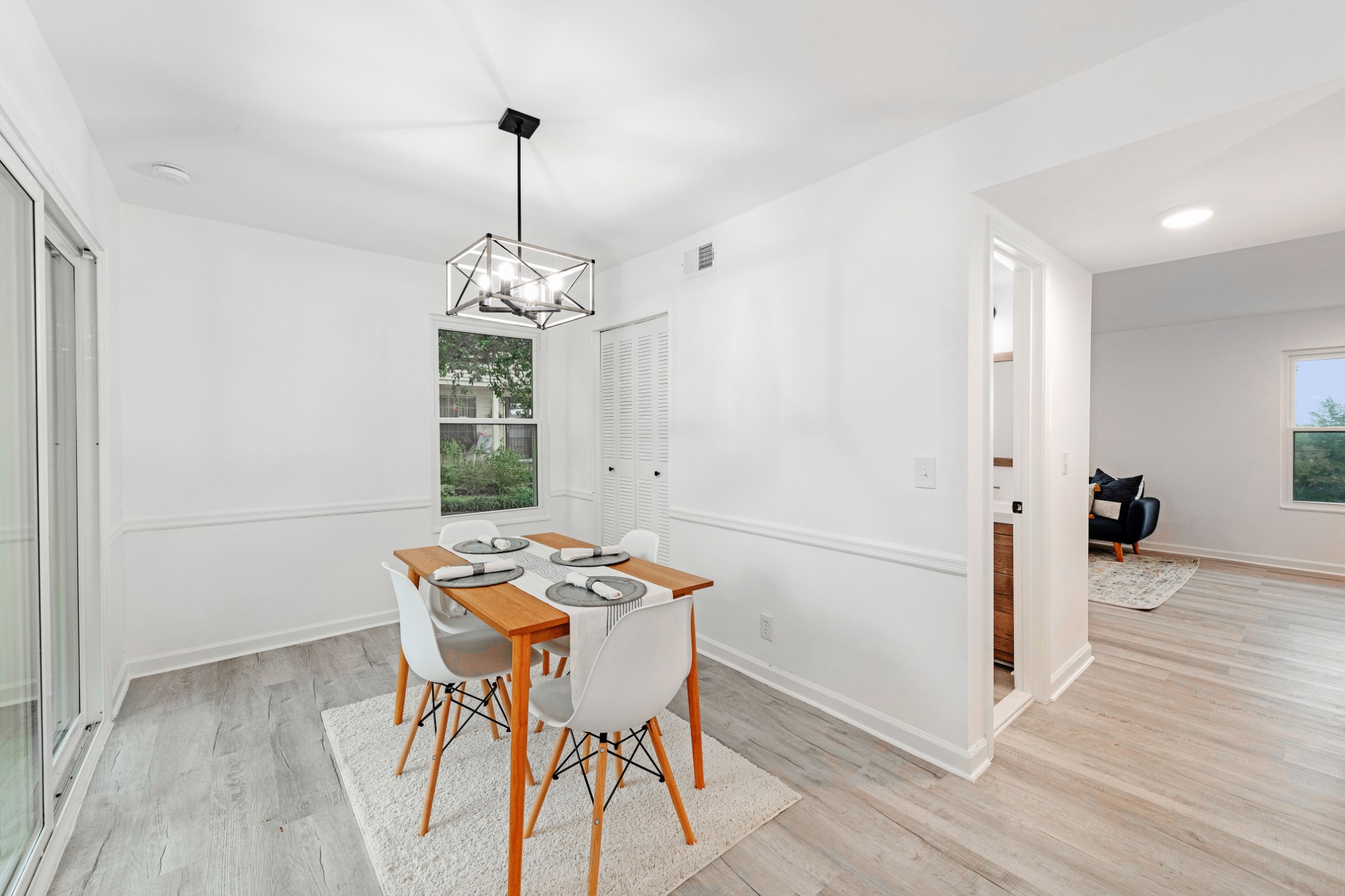 4000 Anderson Road, Unit 12 Nashville, TN 37217 - Photo 12 of 28 a view of a dining room with furniture window and wooden floor