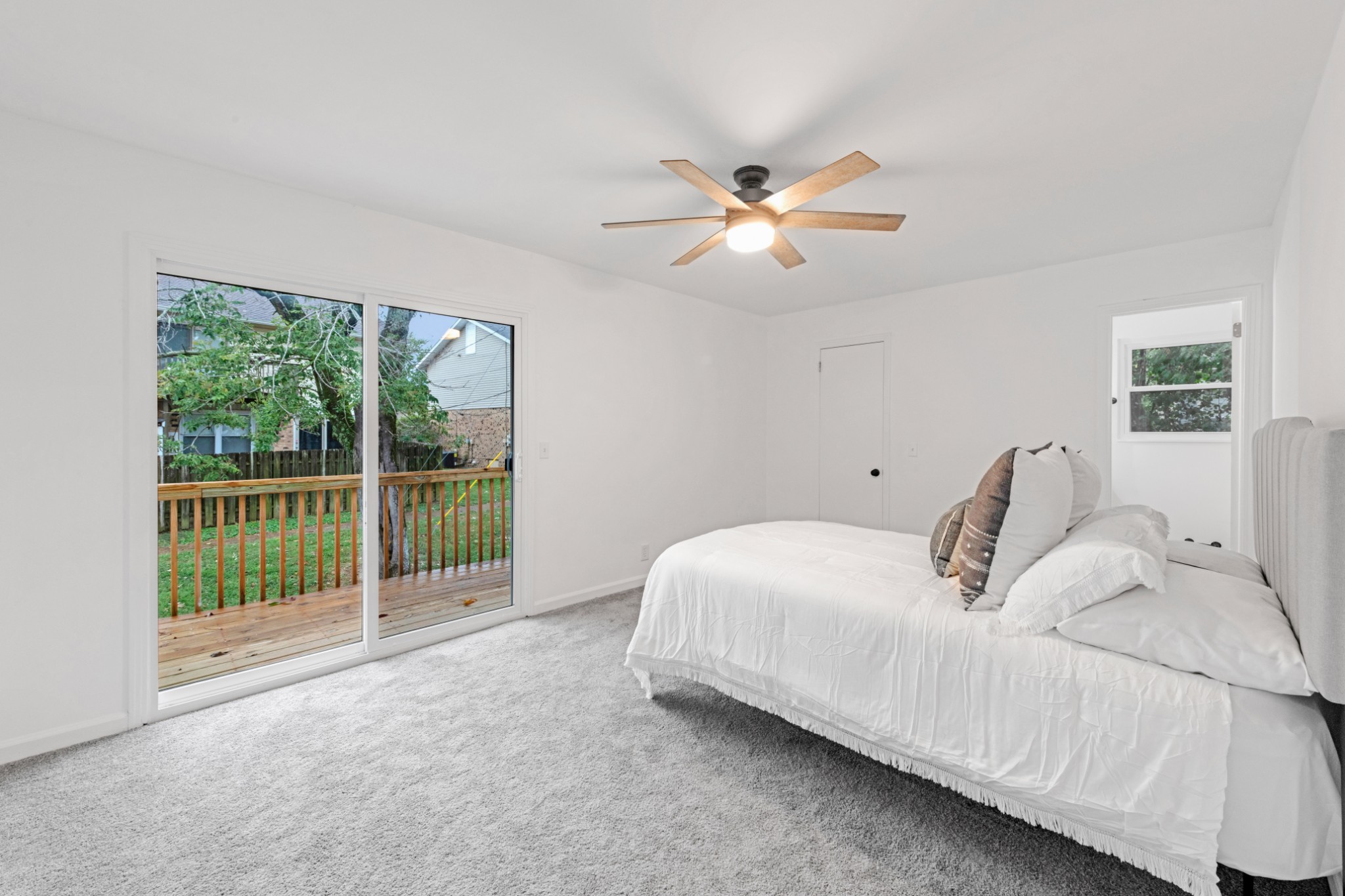 4000 Anderson Road, Unit 12 Nashville, TN 37217 - Photo 17 of 28 a bedroom with a large bed and a fan