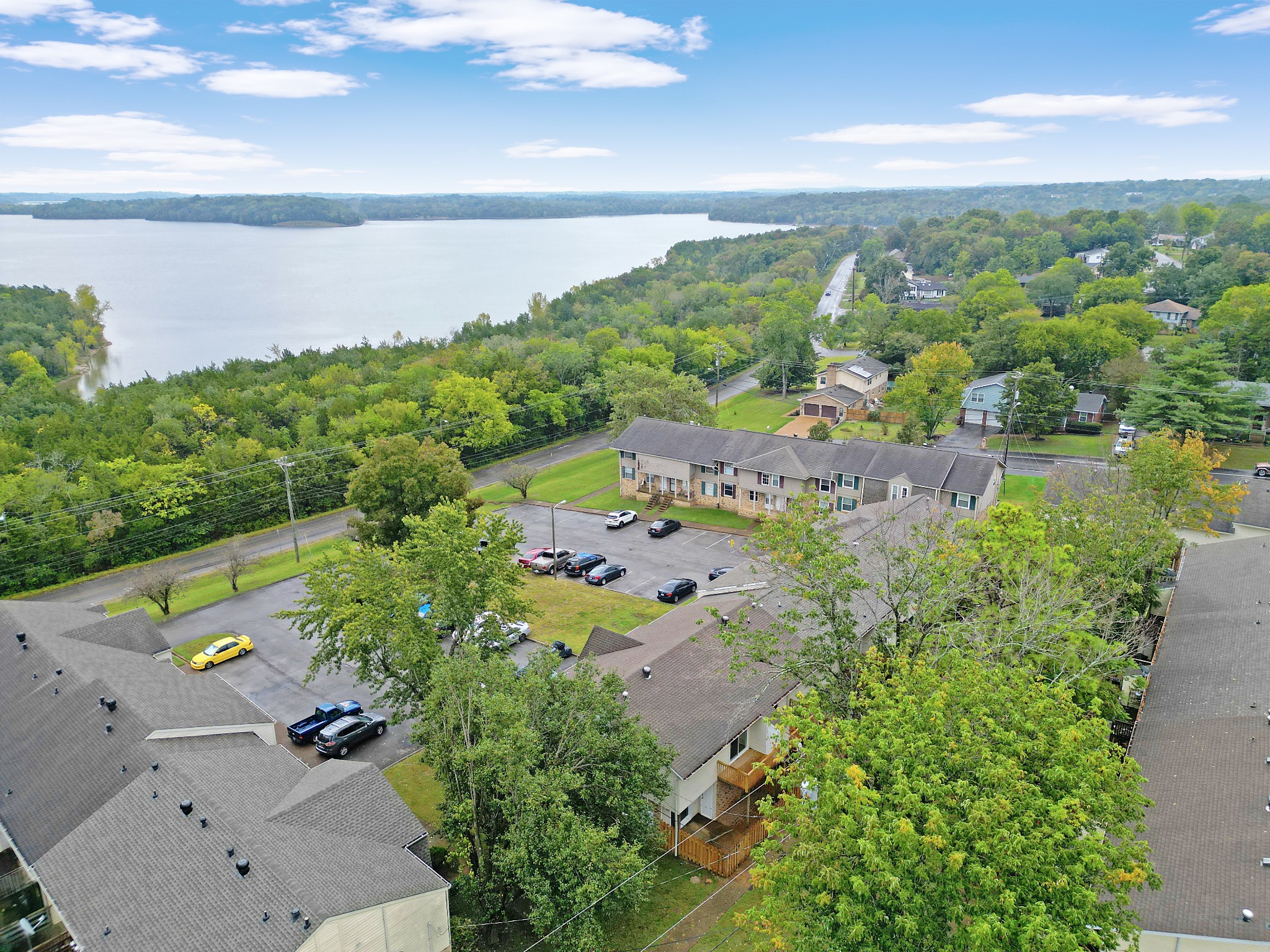 4000 Anderson Road, Unit 12 Nashville, TN 37217 - Photo 2 of 28 an aerial view of a house with a yard and lake view