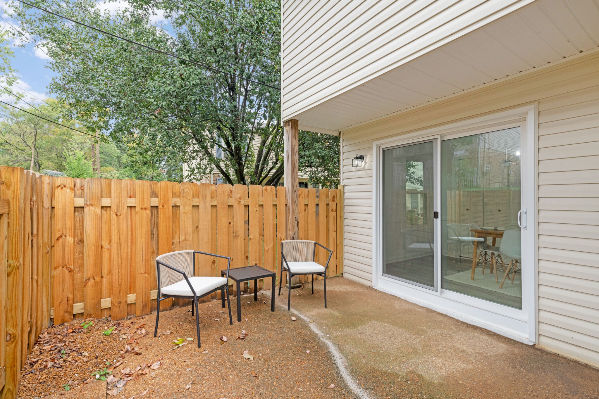 4000 Anderson Road, Unit 12 Nashville, TN 37217 - Photo 24 of 28 a balcony with table and chairs and potted plants