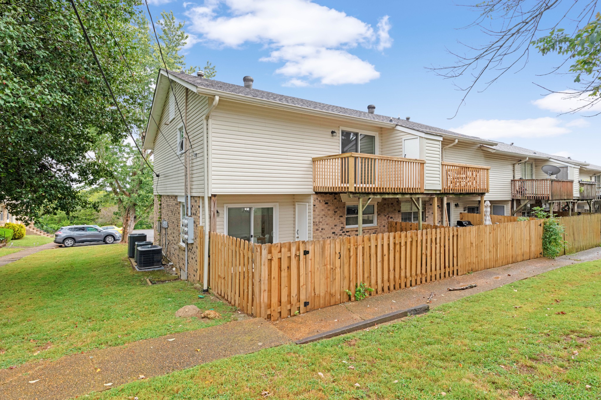 4000 Anderson Road, Unit 12 Nashville, TN 37217 - Photo 26 of 28 a view of a house with a yard and fence