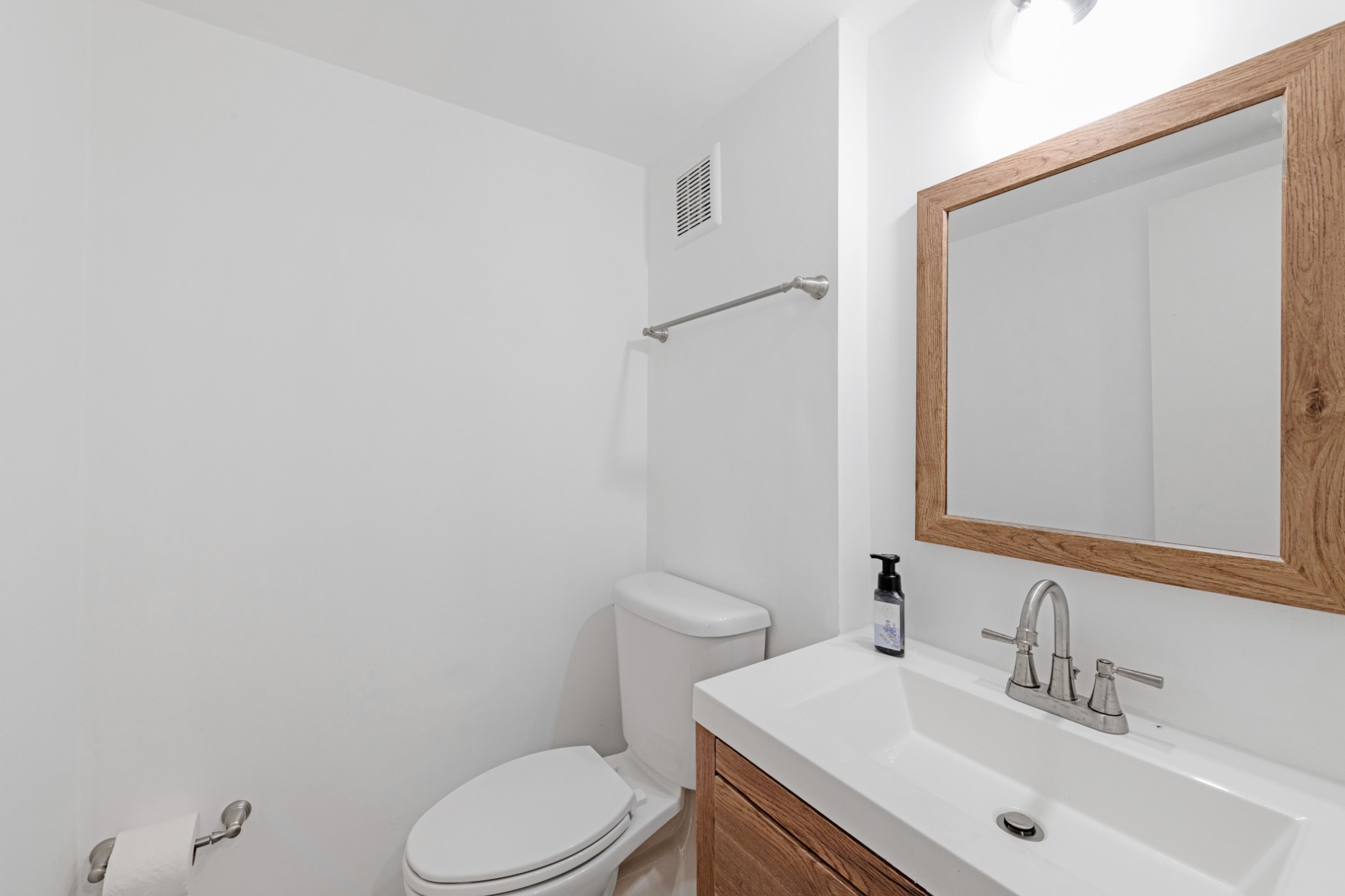 4000 Anderson Road, Unit 12 Nashville, TN 37217 - Photo 8 of 28 a bathroom with a sink a toilet and mirror