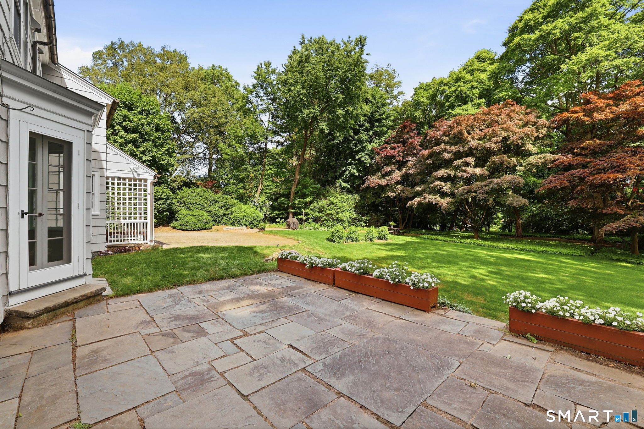 73 Inwood Road Fairfield, CT 06825 - Photo 11 of 40 The bluestone terrace affords terrific views of the backyard.